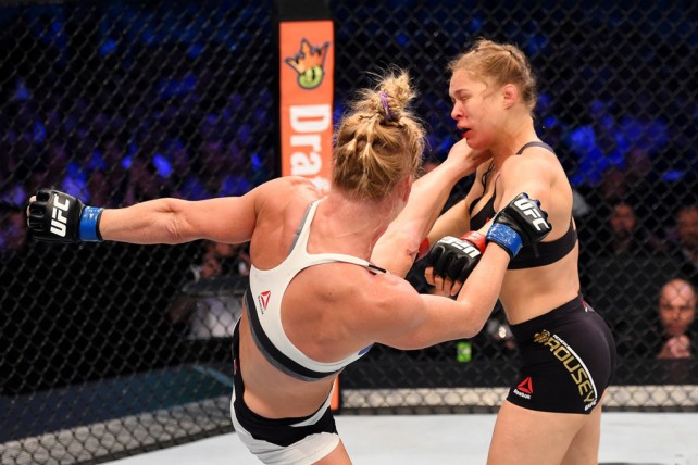 MELBOURNE, AUSTRALIA - NOVEMBER 15: (L-R) Holly Holm lands a left-high kick against Ronda Rousey in the second round of their UFC women's bantamweight championship bout during the UFC 193 event at Etihad Stadium on November 15, 2015 in Melbourne, Australia.  (Photo by Josh Hedges/Zuffa LLC/Zuffa LLC via Getty Images)